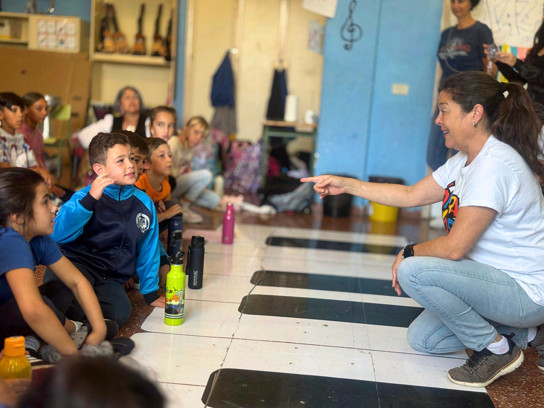 An Opera Kids singer working with a class